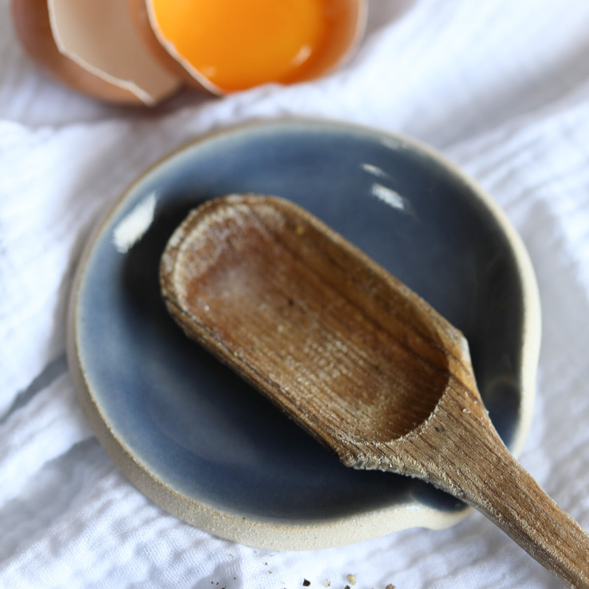 A handmade ceramic spoon rest from the Glosters pottery tableware collection.