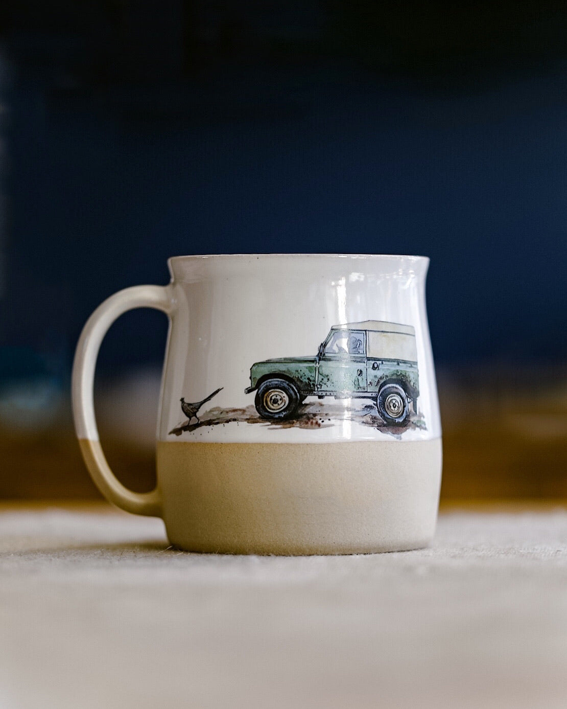 A handmade mug with an illustration of a 4x4 from Glosters.