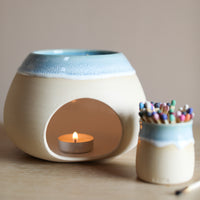 A wax melt burner made from ceramic by Glosters.