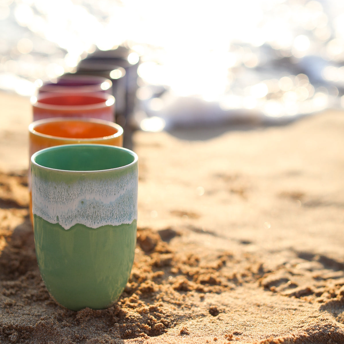 A colourful handmade stoneware drinks beaker from Glosters